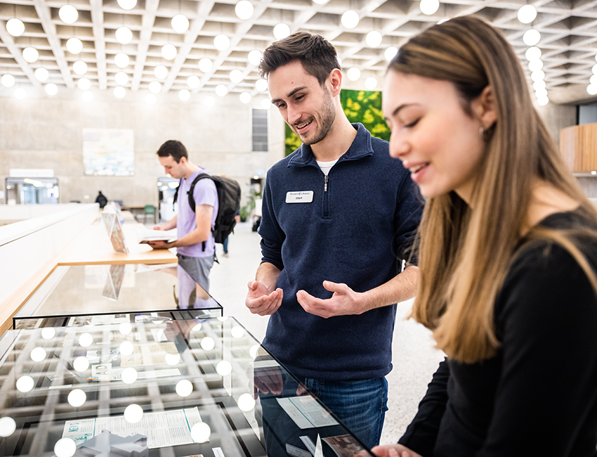 Two people working in Weldon Library
